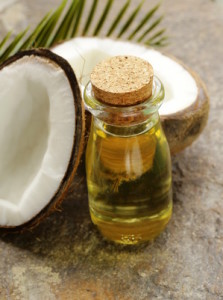 coconut oil in a glass bottle and fresh nuts